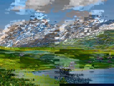 Mountains and green hills with houses